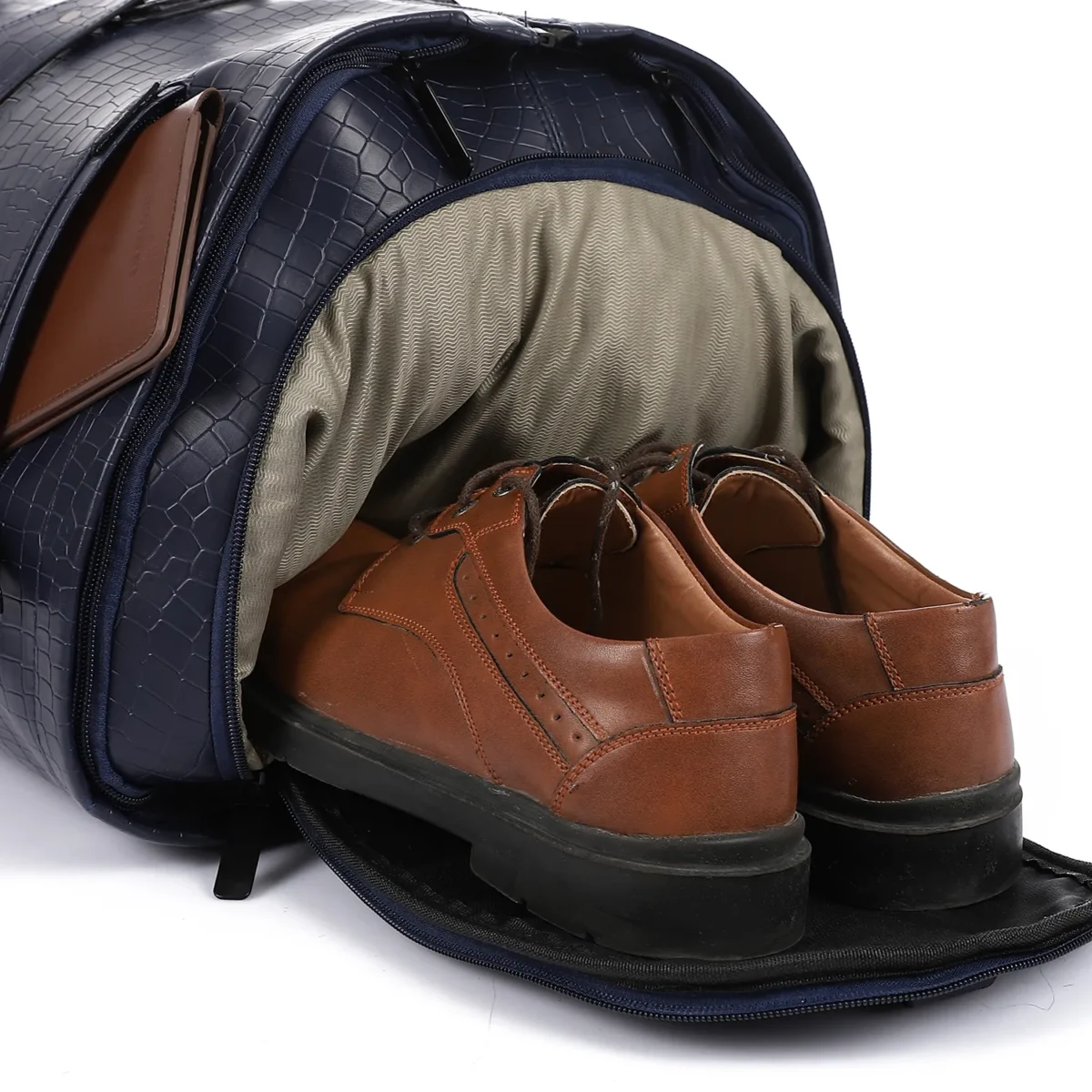 CROSSLAND Brown shoes inside a navy bag