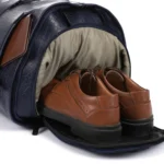 CROSSLAND Brown shoes inside a navy bag